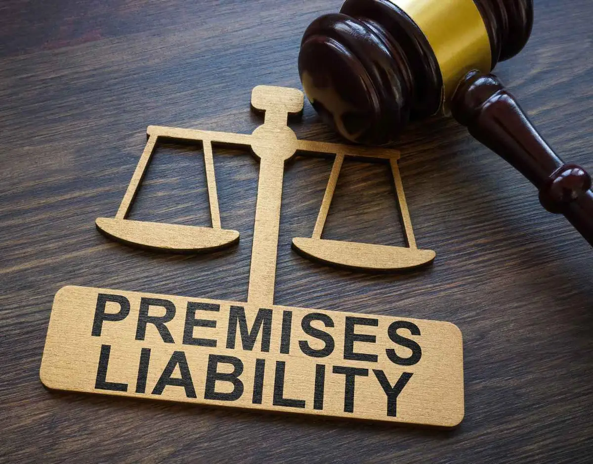 a gavel and premises liability forms on a table