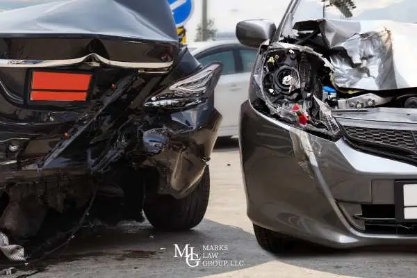 two cars with damage from a rear-end accident