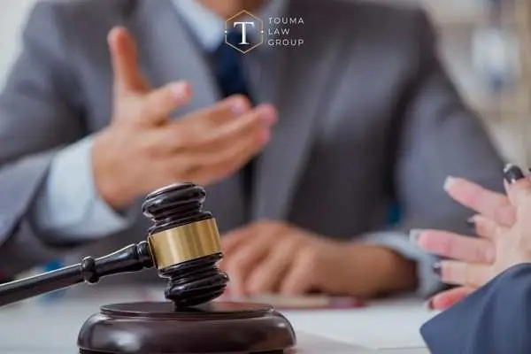 a woman meeting with a criminal defense attorney
