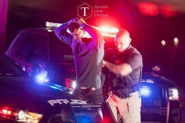 a man being arrested for driving under the influence