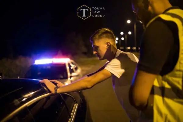 a man being arrested for drunk driving