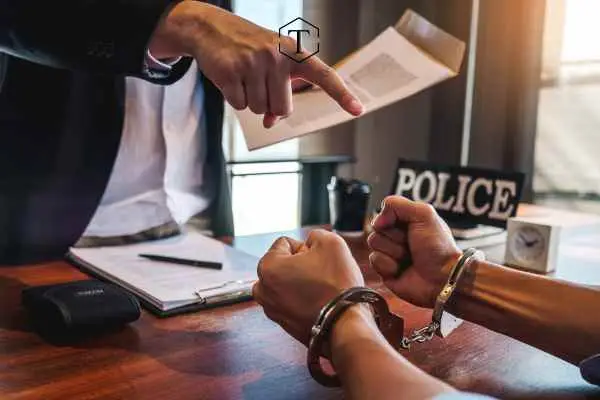a police officer interrogating a person accused of identity theft