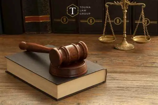 law books a gavel and scales of justice on a desk