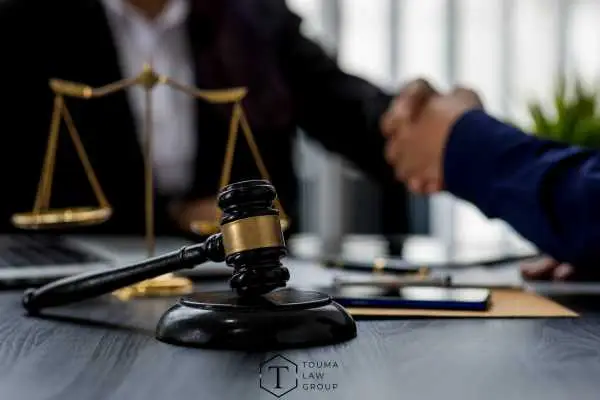 a person meeting with a defense attorney for a consultation