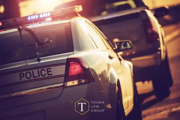 a police officer pulling over a driver in a pickup for suspicion of DUI