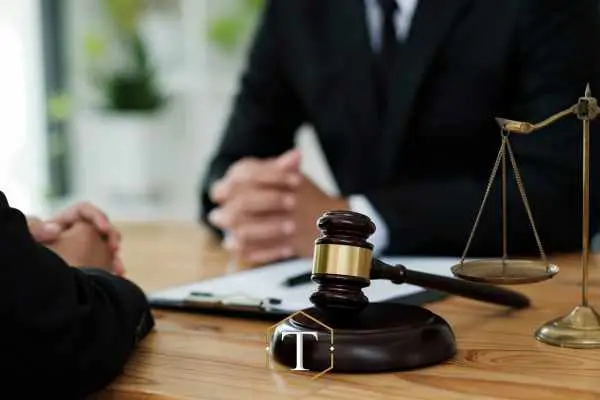 a man discussing an assault charge with a lawyer