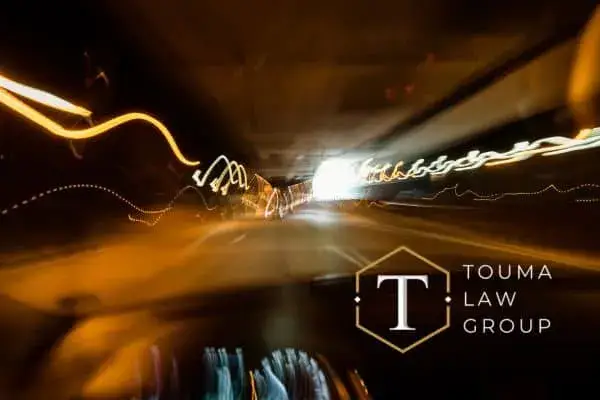 a blurry photo from the interior of a car driving to simulate the affects of alcohol when driving