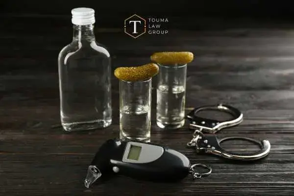 alcohol and a breathalyzer on a table