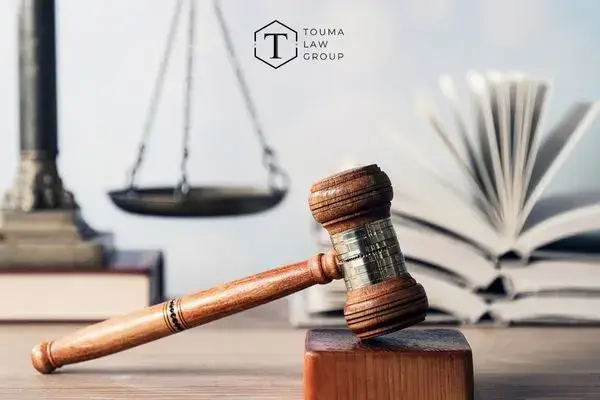 a desk in a law firm with books and a gavel on it