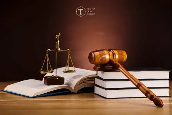 a lawyers desk with legal books and a gavel on it