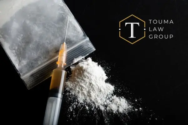 heroin sitting on a table with a needle