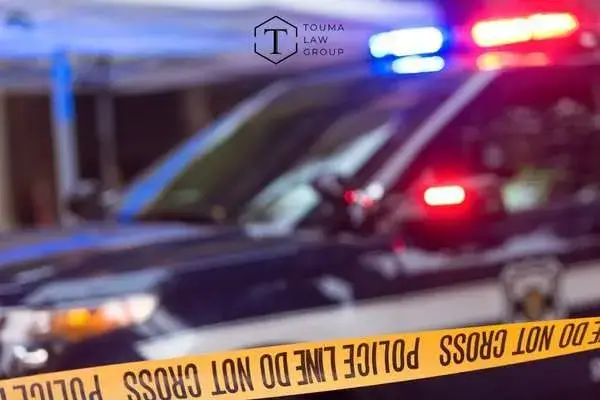 police vehicles and crime scene tape