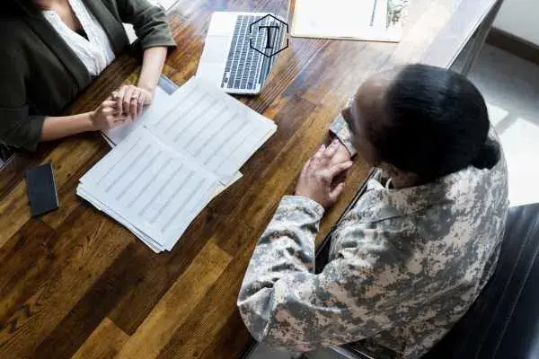 a military service member meeting with a member of the discharge board