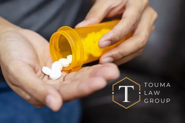 a person taking Adderall out of a bottle that isn't labeled