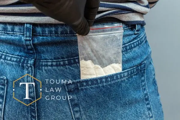 person with probable cause for search and seizure having drugs pulled out of pocket