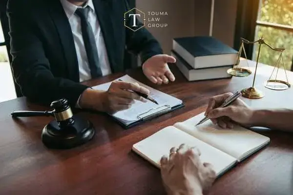 a man asking a criminal defense lawyer questions during a consultation