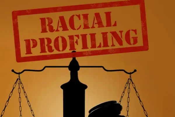 racial profiling stamped with a scale and gavel underneath
