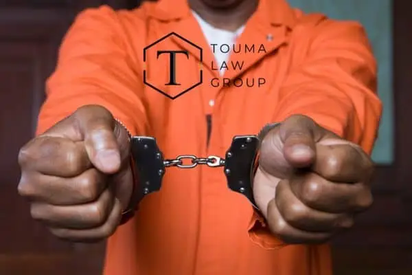 a person in handcuffs wondering what to expect in criminal court