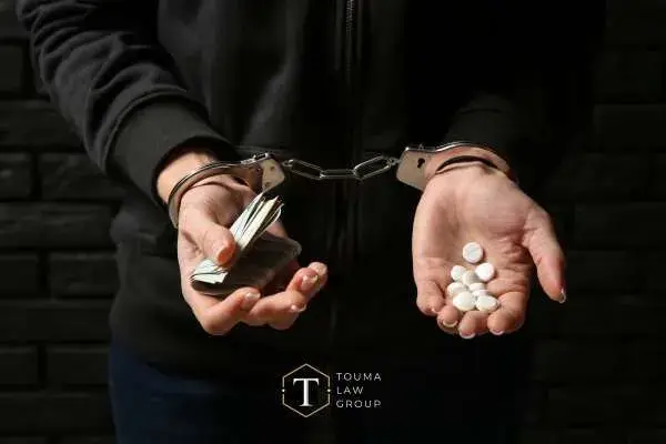 a woman being arrested for drug charges