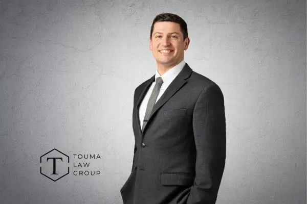 attorney christian capps in a suit
